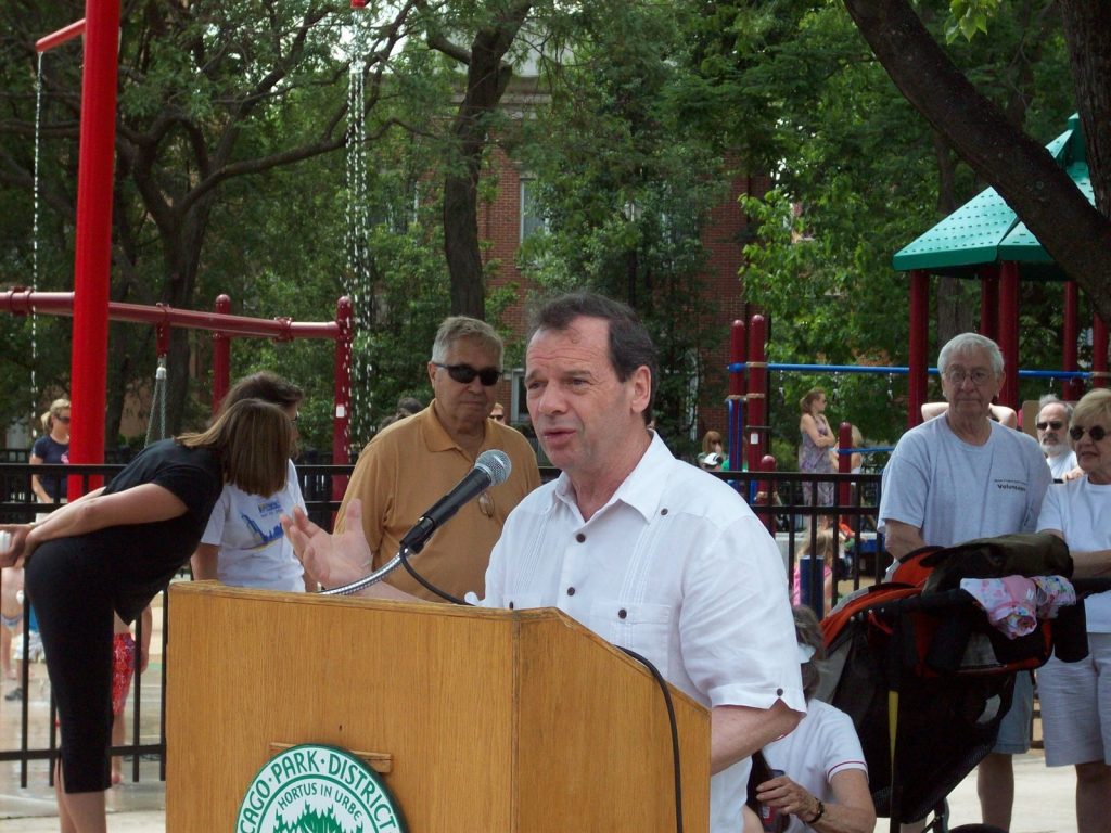 Guest speaker with white shirt speaking at Jonquil Park
