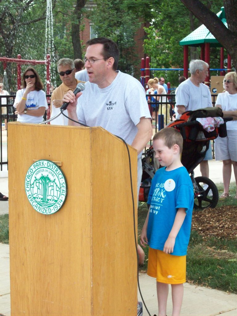 Guest speaker with son speaking at Jonquil Park
